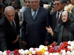 Armenians lay flowers at the memorial to the Armenians killed in the Ottoman Empire during a memorial ceremony to mark the 90th anniversary of the mass killings, in Yerevan, Sunday, April 24, 2005. Armenia accuses Turkey of genocide in the killings of up to 1.5 million Armenians, during World War I and the collapse of the Ottoman Empire, as part of a campaign to force them out of eastern Turkey.  (AP Photo/Karen Minasian)