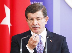 Turkish PM Davutoglu gestures as he attends a news conference after a meeting with his Ukrainian counterpart Arseny Yatseniuk in Kiev