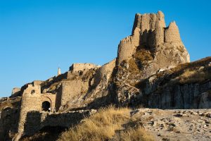 The Van Castle (or fortress, also called the Van Kalesi), rises in ruins atop a hill. Built in the 9th Century B.C. by King Sarduri I of the Urartu Kingdom, the fortress was essential for regional control. Of great historical significance, the fortress includes a massive inscription by Xerxes the Great in three languages:  Old Persian, Babylonian, and Elamite.